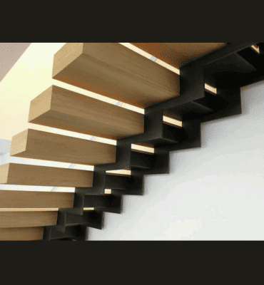Escalier flottant contemporain en bois avec éclairage intégré, réalisé par Abiver à Montpellier, ajoutant une ambiance chaleureuse et moderne.